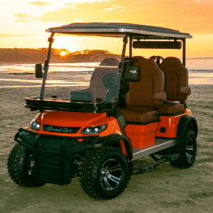 Beach sunset with orange golf cart
